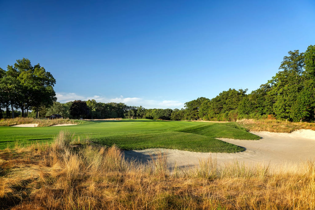 Bethpage Black’s first tee grandstand during the 2025 Ryder Cup, fans packed around the elevated tee box