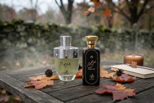 , Afnan Rare Carbon and Al Wataniah autumn fragrance bottles on rustic wood with fall leaves