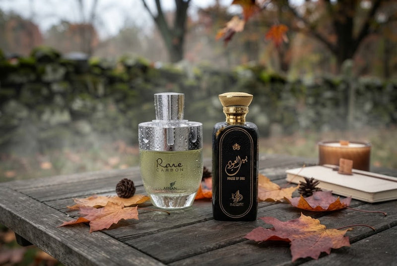, Afnan Rare Carbon and Al Wataniah autumn fragrance bottles on rustic wood with fall leaves