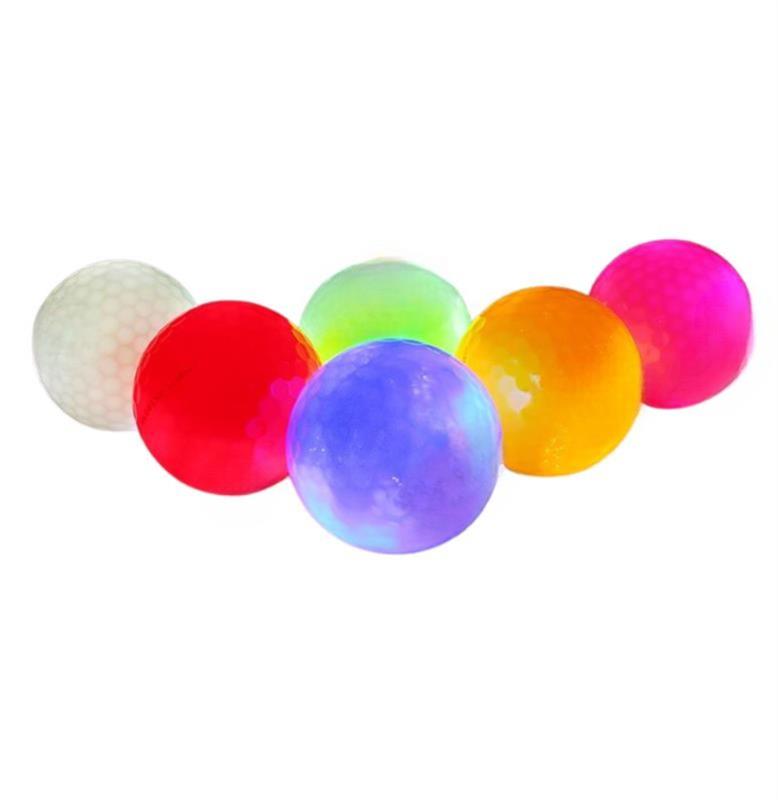 Set of six colorful LED golf balls on a white background
