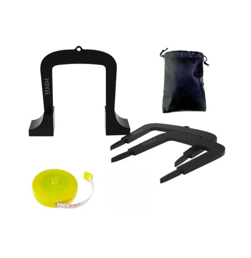 Set of black putting trainer gates , a tape measure, and a black drawstring bag on a white background.
